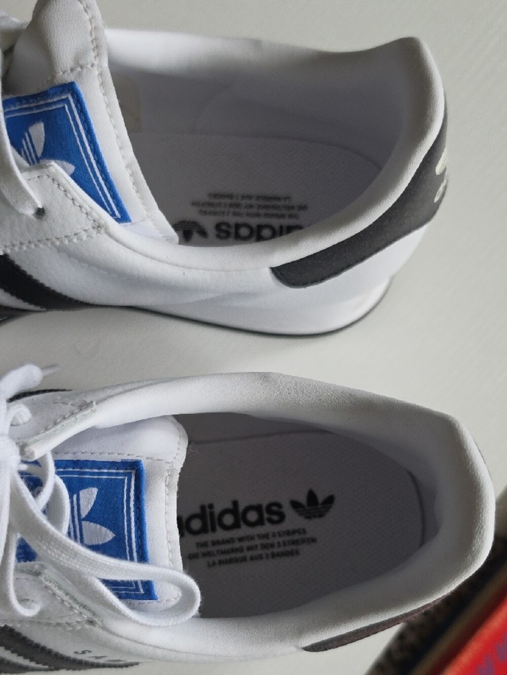 adidas White Sneakers with Black Stripes and Blue Tongue Accent - Picture 2 of 6
